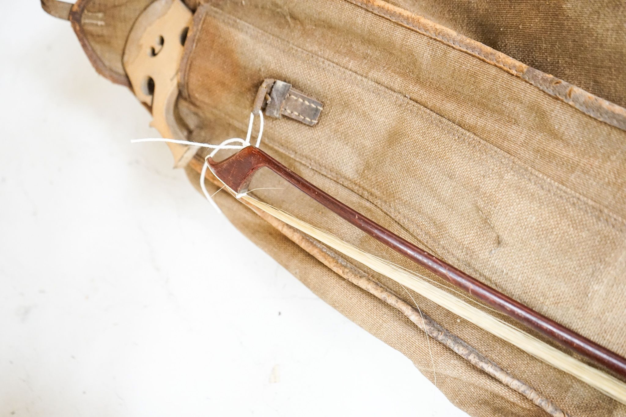 A late 19th century French cello, lob 75.5cm, canvas case with bow